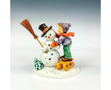 Hand painted modeled as a young boy making a large snowman. M. I. Hummel impressed backstamp. Goebel backstamp. Dimensions: 6