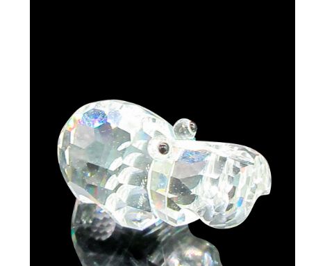 Cute miniature hippo with black eyes. This item has its original box: 3.25"L x 3.25"W x 5"H. Dimensions: 3"L x 2"W x 1.5"HMan