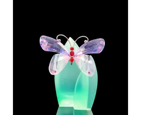 Depicts a butterfly with violet wings resting on top of foggy green leaves. Swarovski backstamp. This item has its original b