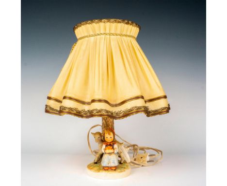 Electric figural lamp hand painted in matte finish modeled as a young girl seated with her little lamb holding flowers. Inclu