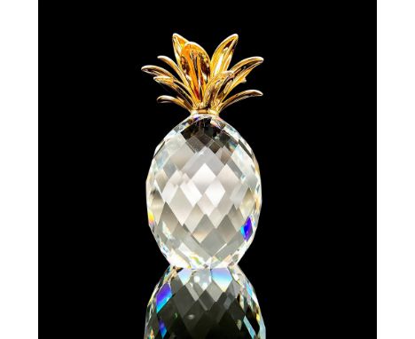 Gorgeous faceted crystal figurine modeled as a pineapple with metal golden crown. Swarovski acid marks. This item has its ori