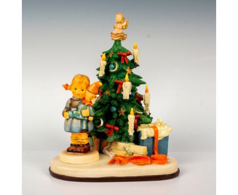 Limited edition hand painted in matte finish designed to be displayed atop the Christmas theme base. Base plays the tune O'Ta