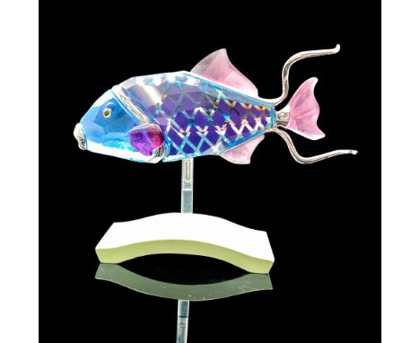Depicts a blue crystal tropical fish with purple crystal used for the fins. Swarovski backstamp. This item has its original b
