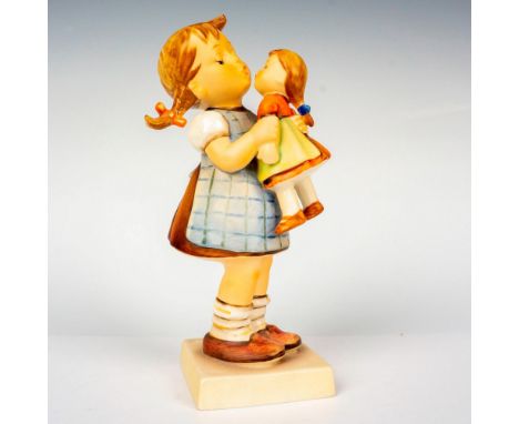 Hand painted in matte finish modeled as a young girl playing with her doll. M. I. Hummel impressed backstamp. Goebel backstam