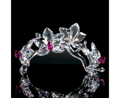 Part of In The Secret Garden series. Lead crystal figure modeled as beautiful clear and pink crystal orchids on a vine. Swaro