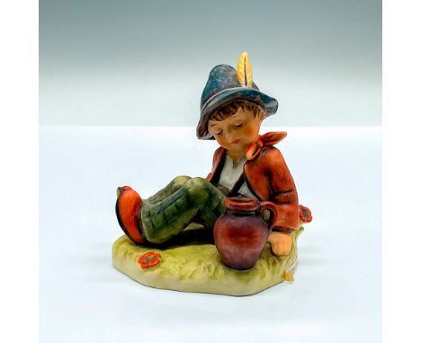 Exclusive special edition hand painted figure of a young boy resting. Goebel Hummel backstamp. Issued: c. 1979-1990Dimensions