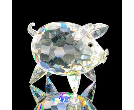 Depicts a clear pig standing on all four legs with black crystal used for the eyes and snout. Swarovski backstamp. This item 