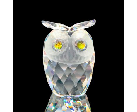 Depicts a clear owl with a fogged glass face and cantaloupe-colored eyes. Swarovski backstamp. This item has its original box