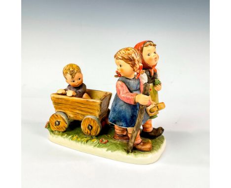 Part of the Century Collection. Ceramic figures of two girls and a boy in wooden cart. Hummel impressed mark. Goebel backstam
