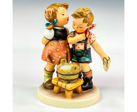 Hand painted in matte finish modeled as children getting ready for a bath. M. I. Hummel impressed backstamp. Goebel backstamp