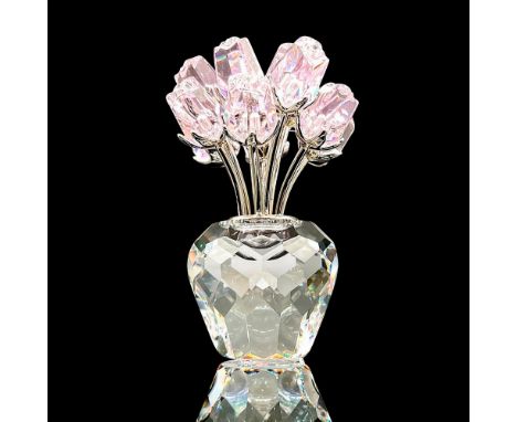 Gorgeous faceted crystal figurine modeled as a vase bursting with gem studded pink roses. Swarovski acid marks. This item has