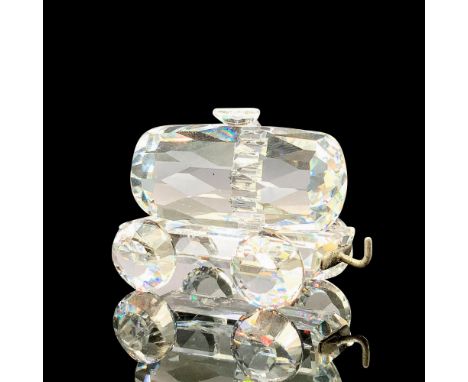 A clear crystal figure of a train tank wagon on four crystal wheels with a metal coupler. This item has its original box. Swa