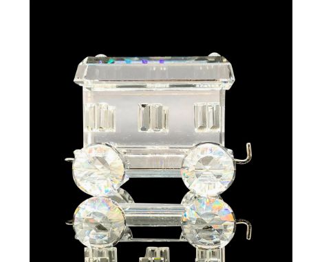 Sparkling faceted crystal figurine modeled as a carriage wagon. Has silver hook and eye loop. Part of the Swarovski Train Set