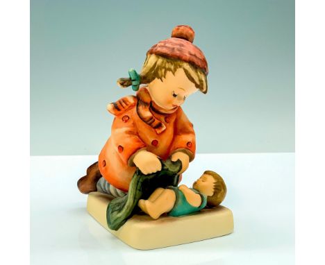 A figure of a young girl in a red jacket and hat tucking in her younger sibling with a blanket. Goebel Hummel backstamp. Issu