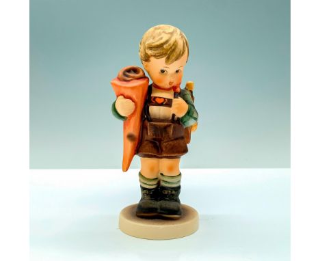 A figure of a young blond boy in his school outfit with his backpack and snack bag. Goebel Hummel backstamp. Certificate of A