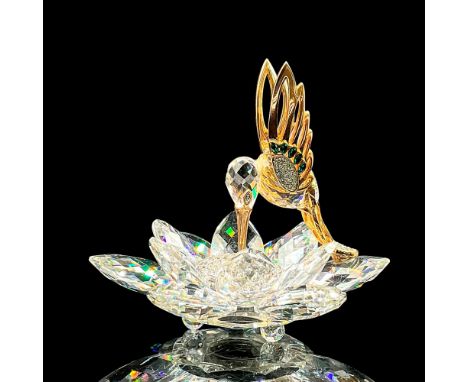 Spectacular cut crystal figure of a gold and crystal hummingbird in the middle of a lotus flower. Small crystals fill the cen