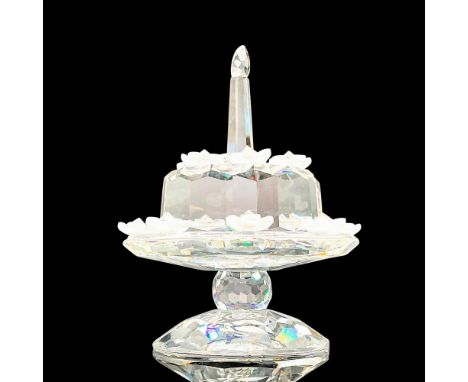 Adorable faceted crystal figurine modeled as a birthday cake on a cake stand; decorated with frosted gem studded daisies and 