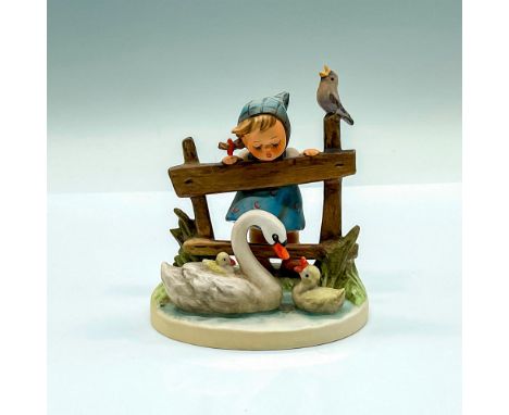 Hand painted figure of a young girl watching a family of swans. Goebel Hummel backstamp. HUM 344. Issued: c. 1979-1990Dimensi