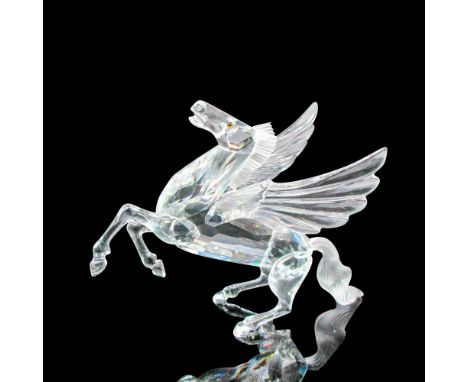 Clear crystal with amber colored eyes. This item has its original box: 10"L x 10"W x 5"H. Certificate of Authenticity include