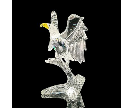 Stunning cut crystal figure of a mighty eagle perched with wings expanded. The beak is yellow, eyes are blue/green. Model num