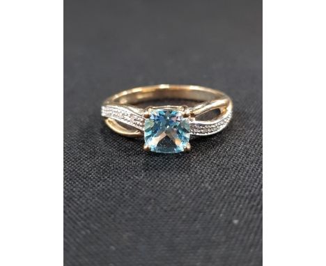 9 CARAT GOLD DIAMOND AND BLUE TOPAZ RING 