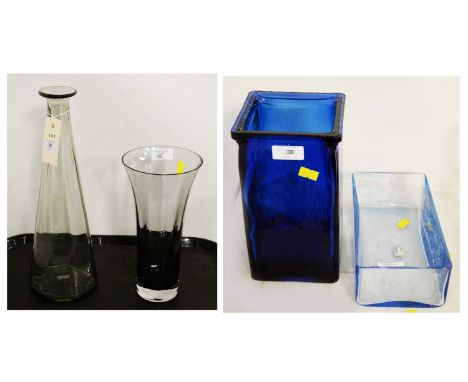 Glassware including a smoky glass vase and decanter; a sea-blue Whitefriars glass trough; and a blue glass square form vase.