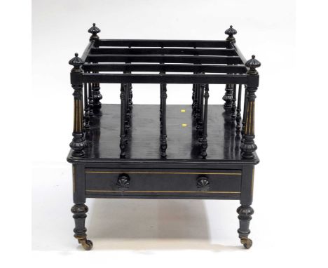 A Victorian ebonised mahogany four division canterbury, circa 1860, with melon fluted terminals, fitted with a single drawer,