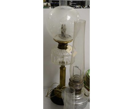 A 19th Century oil lamp with etched glass shade, cut-glass clear reservoir and column form brass base, 72cms high, later conv