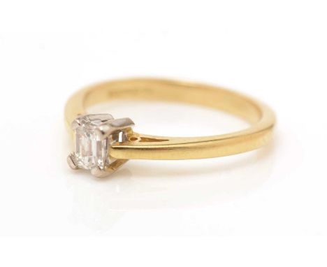 A single stone diamond ring, the baguette cut diamond weighing approximately 0.25carats, on 18ct yellow gold shank, ring size