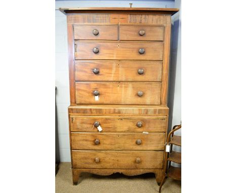 A Victorian mahogany chest-on-chest, the upper section with inlaid frieze above two short and three long graduated drawers, t