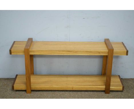 A modern teak and zebra wood wall hanging shelf unit, 117 x 31 x 51cms high.