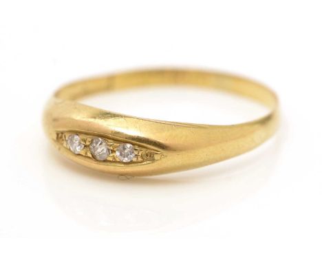 A three stone diamond ring, the graduated old cut diamonds in marquise shaped setting, 18ct yellow gold shank, ring size R, 1