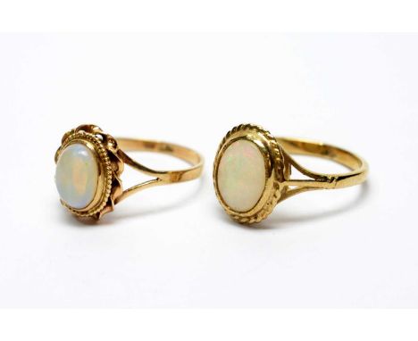 Two opal rings, each set with oval opal cabochons on 9ct yellow gold shanks, 4.5g gross. 
