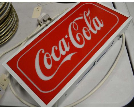 A Coca-Cola bar light, with power-saving chargeable LED light, and plug.