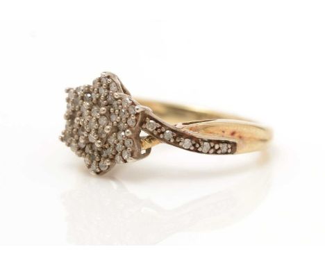 A diamond cluster ring, on 9ct yellow gold shank, ring size K, 2.8g gross. 