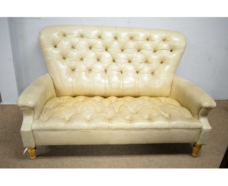 Vanguard Furniture, Hickory, North Carolina: a Chesterfield-style leather upholstered sofa with shaped arms, raised on turned