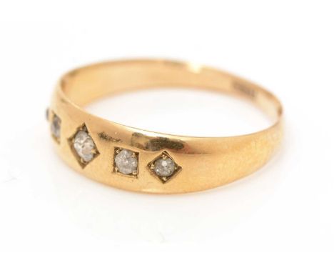 A five stone diamond ring, on 18ct yellow gold shank, ring size Q, 3.2g gross. 