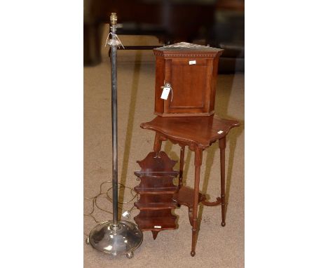 An early 20th Century mahogany occasional table, the shaped top raised on turned legs joined by an undertier, 42 x 42 x 71cms