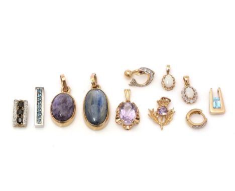 A selectin of gem set pendants in 9ct yellow gold mounts. including opal, amethyst and others, 28.0g gross 