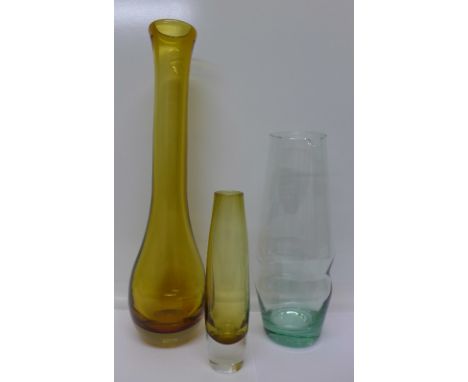 Three pieces of Swedish Aseda glass; comprising two cased vases and a tinted glass decanter; a decanter and large vase by Bo 