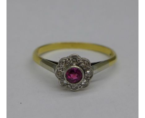 An 18ct gold, ruby and diamond cluster ring, 2.2g, N