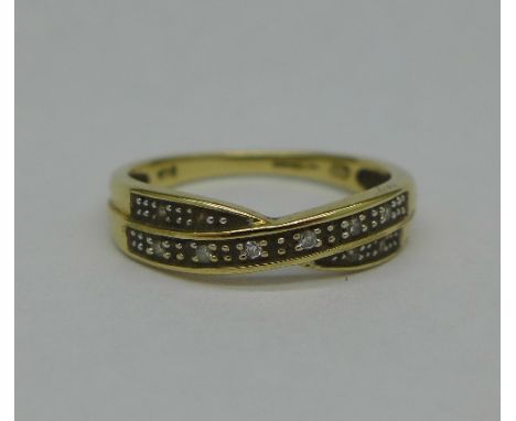 A 9ct gold and diamond ring, 1.9g, L