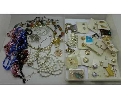 Vintage bead necklaces, jewellery, and costume earrings, mounted on original display cards