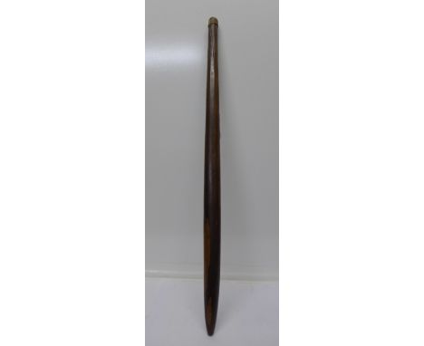 An Australian Aboriginal throwing stick, with long vertical incised grooves, and tapered end, 75cm