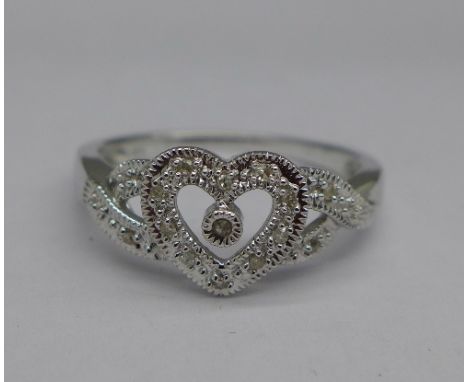 A 10ct white gold ring set with fifteen diamonds, 2.5g, O