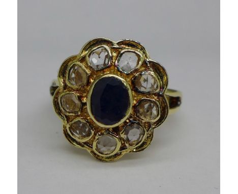 A silver set sapphire and topaz ring, S
