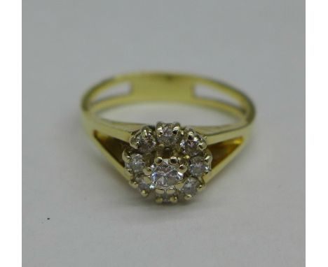 A yellow metal set diamond cluster ring, 3.4g, N