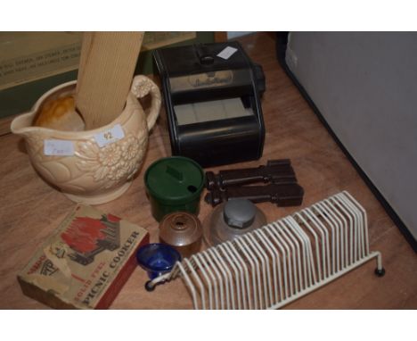 An assortment of vintage odds and ends including various bakelite items, a set of carpet grips, a green mustard pot 'G vi R' 