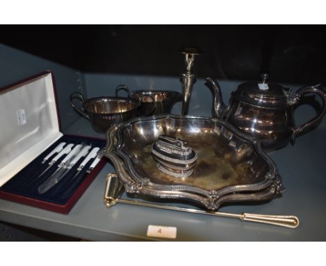 A selection of plated metal wares including graduated trays and part L R S tea set