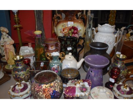 A large mixed lot of miscellaneous ceramics and glass of varying ages and styles. Included are jugs, tea pots and trinket box